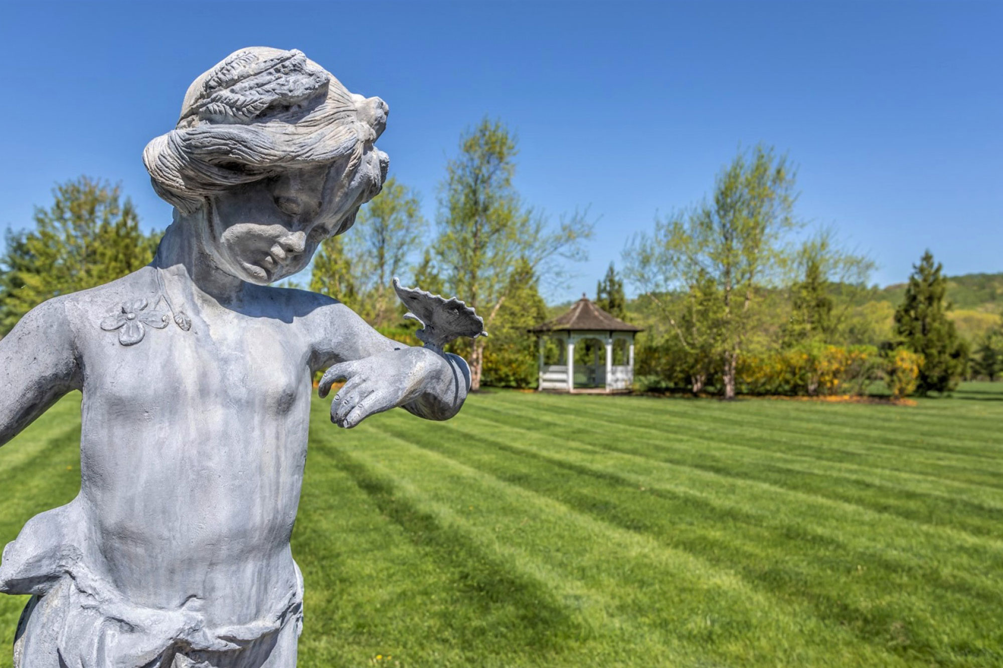 Statue with Butterfly and Gazebo in background